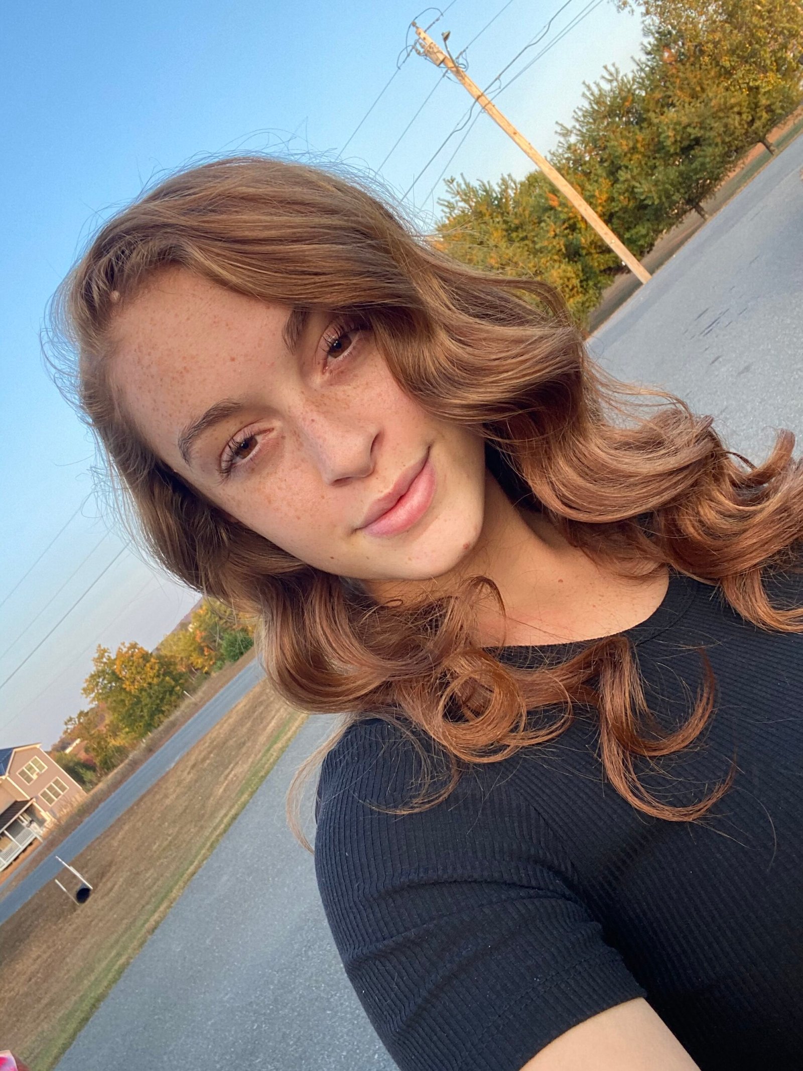 a women taking a picture outside